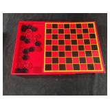 Plastic Chess board with some pieces