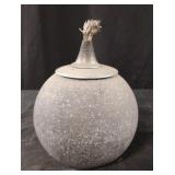 Spherical stone oil lamp.