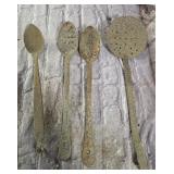 antique hand-forged iron cooking ladles and a