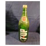 Vintage 7 Up green glass soda bottle with lid