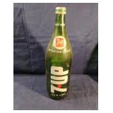 Vintage 7 Up green glass soda bottle with lid