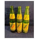Vintage green Mello Yellow glass bottles 10 fl.