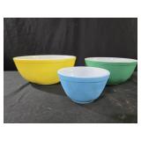 vintage Pyrex mixing bowls, likely from the