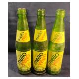 Vintage green Mello Yellow glass bottles 10 fl.