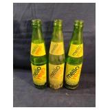 Vintage green Mello Yellow glass bottles 10 fl.