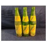 Vintage green Mello Yellow glass bottles 10 fl.