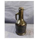 Vintage small green olive oil bottle with handle