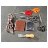 Scissors, alarm clock-works, wallet, butter