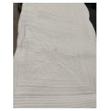 Quilt with ruffled edge. Has spots. 88 x 80