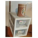 Stackage storage bins and a metal tin can with