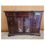 vintage-style wooden jewelry armoire featuring