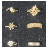 Assortment of fashion Rings- one missing a stone