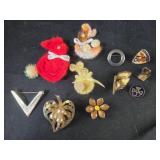 Assortment of pins and broochs
