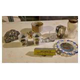 Assorted souvenirs,  pottery cup, key hide