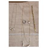 Necklaces, bracelet ring and pink stone pendant