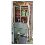 Contents of cabinet - scale, cleaner, candle