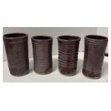 Four pottery drinking cups New Varies 5 inches