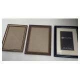 Three picture frames two 5 x 7 frames and one 4