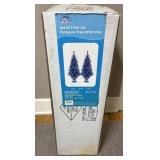Two pre-lit entrance trees with urns New Clear