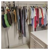 Clothes rack including clothes and more..... 69 x