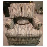 Odom style skirted club chair features a