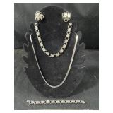 Two Silver Colored Jewelry Sets