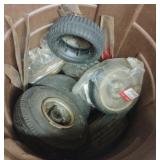 Misc wheels and blades in a Rubbermaid Roughneck