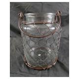 Glass jar 7 5" covered in wire