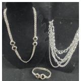 Silver Colored Necklaces - one is a 3pc set that