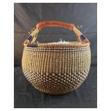 handmade round Bolga market basket featuring a