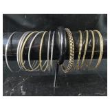 Group of silver and gold colored bangle bracelet
