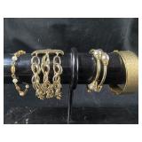 Group of gold colored Bracelets