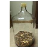 large glass carboy partially filled with U.S.