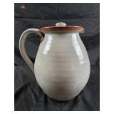 studio art pottery pitcher with a reddish-brown