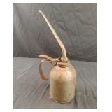 Vintage pump oil can. Has liquid