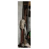 Metal poles, wood poles, shop broom, mop and