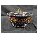 vintage Daher footed tin container featuring an