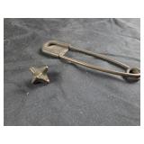 Antique metal jack and oversized pin
