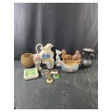 Assortment of pottery urns, vintage flower frogs,