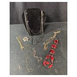 Vintage costume jewelry including necklaces,