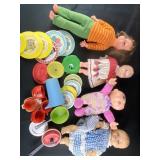 Baby dolls and kitchenware