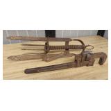 Vintage pipe wrench and metal mole trap