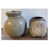 Eddie Smith pottery both have a Crack