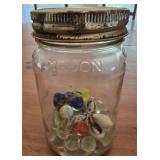 Glass mason jar with marbles
