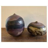 Two closed-form ceramic sculpture