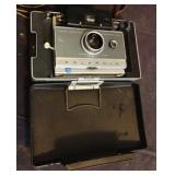 Vintage Polaroid camera in case