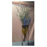 decorative vase with faux flowers features an