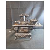 vintage Crescent cast-iron miniature toy and