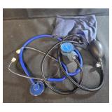 manual aneroid sphygmomanometer with a blue arm