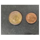 Canada 1ï¿½ penny and a "Good Luck" token